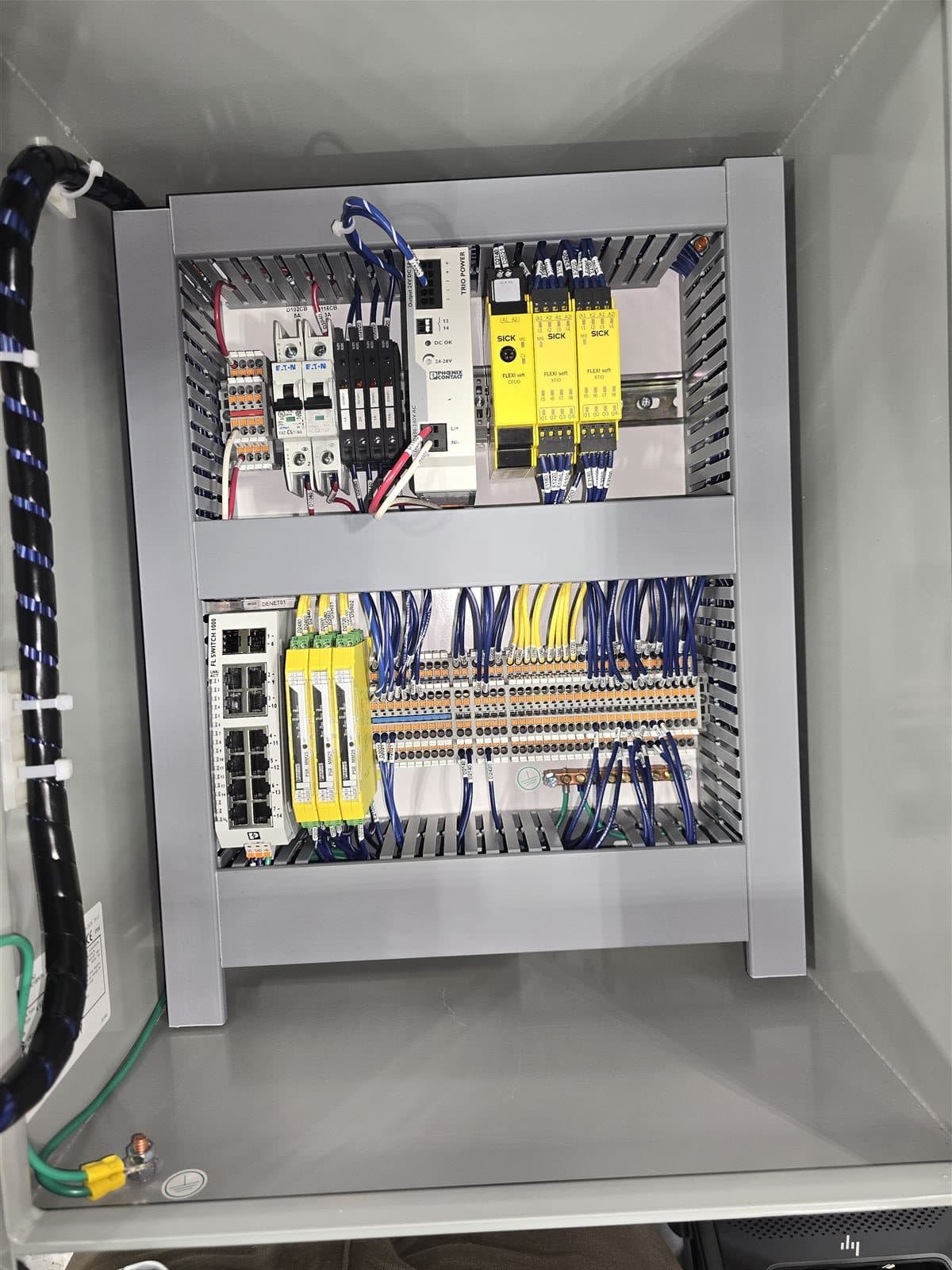 Industrial control panel with Ethernet switch and safety relays