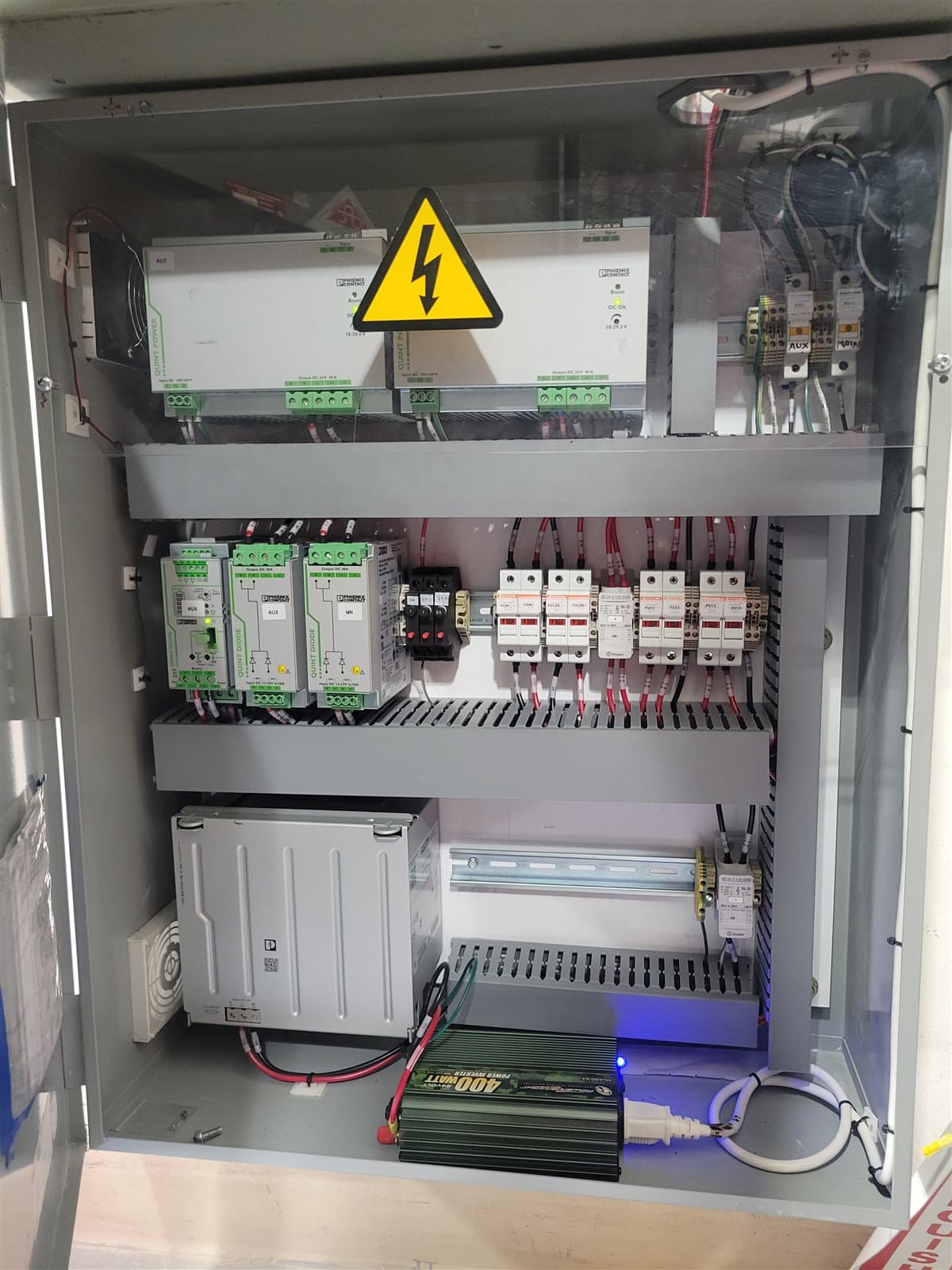 Power distribution panel with surge protection and diode modules