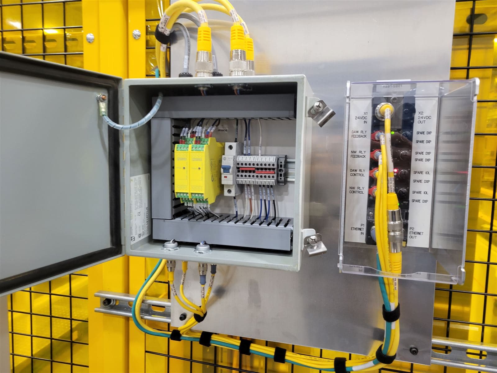 Safety relay wired into a control panel interior