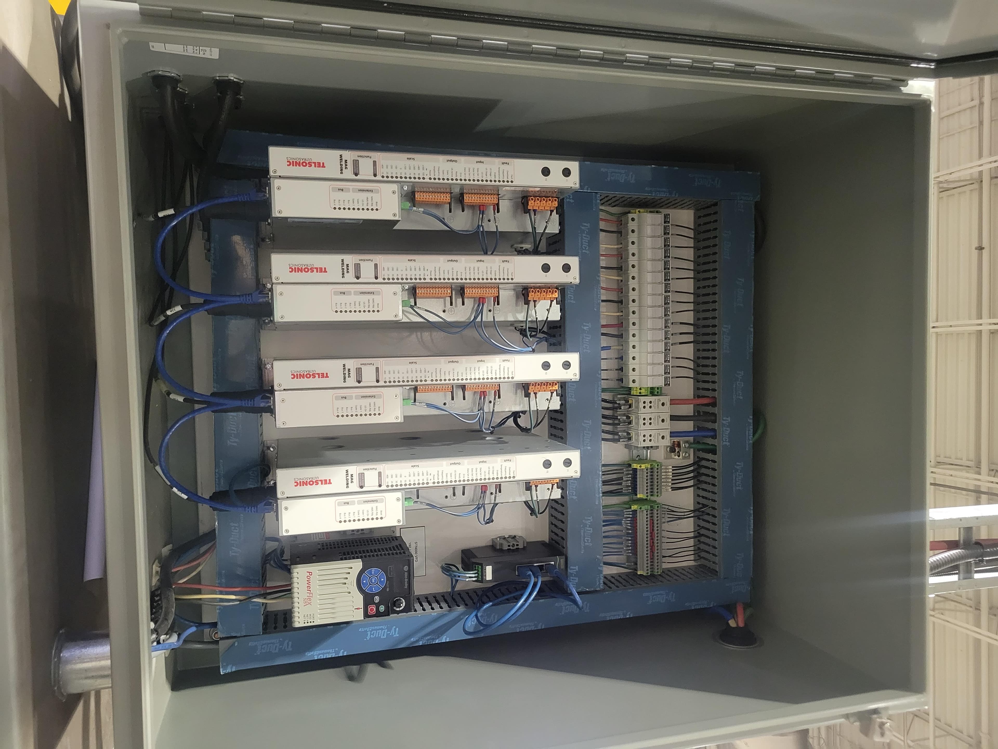 Control panel with stacked Telsonic ultrasonic welding controllers and VFD