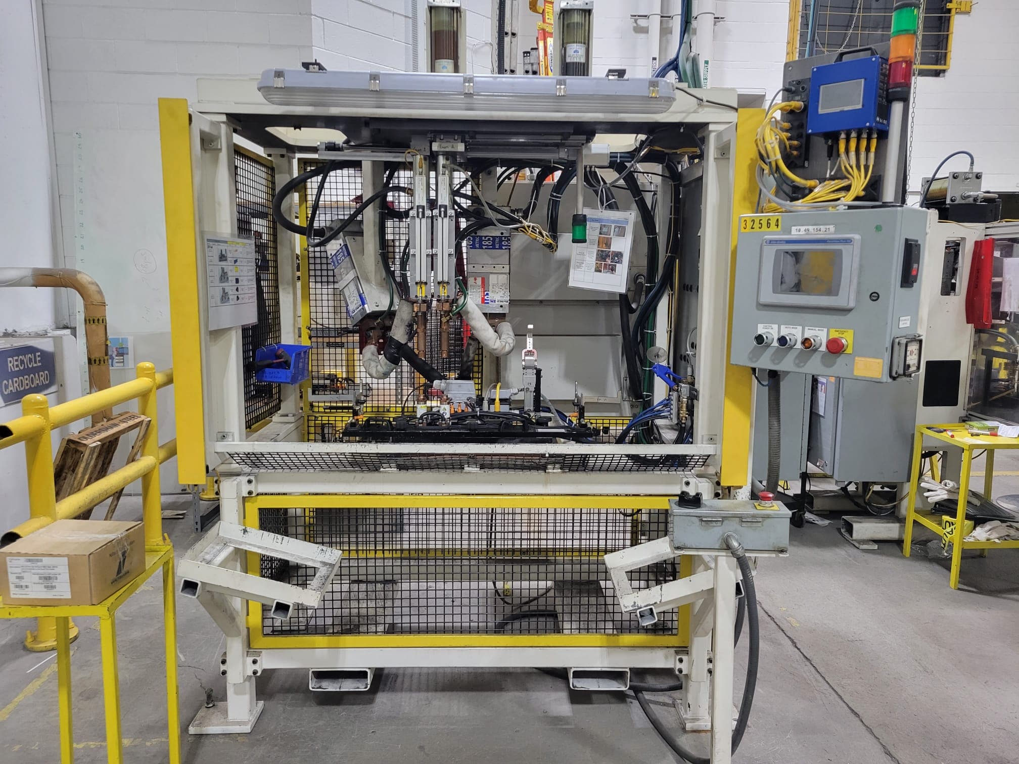 Production machine with upgraded controls and guarding after a retrofit