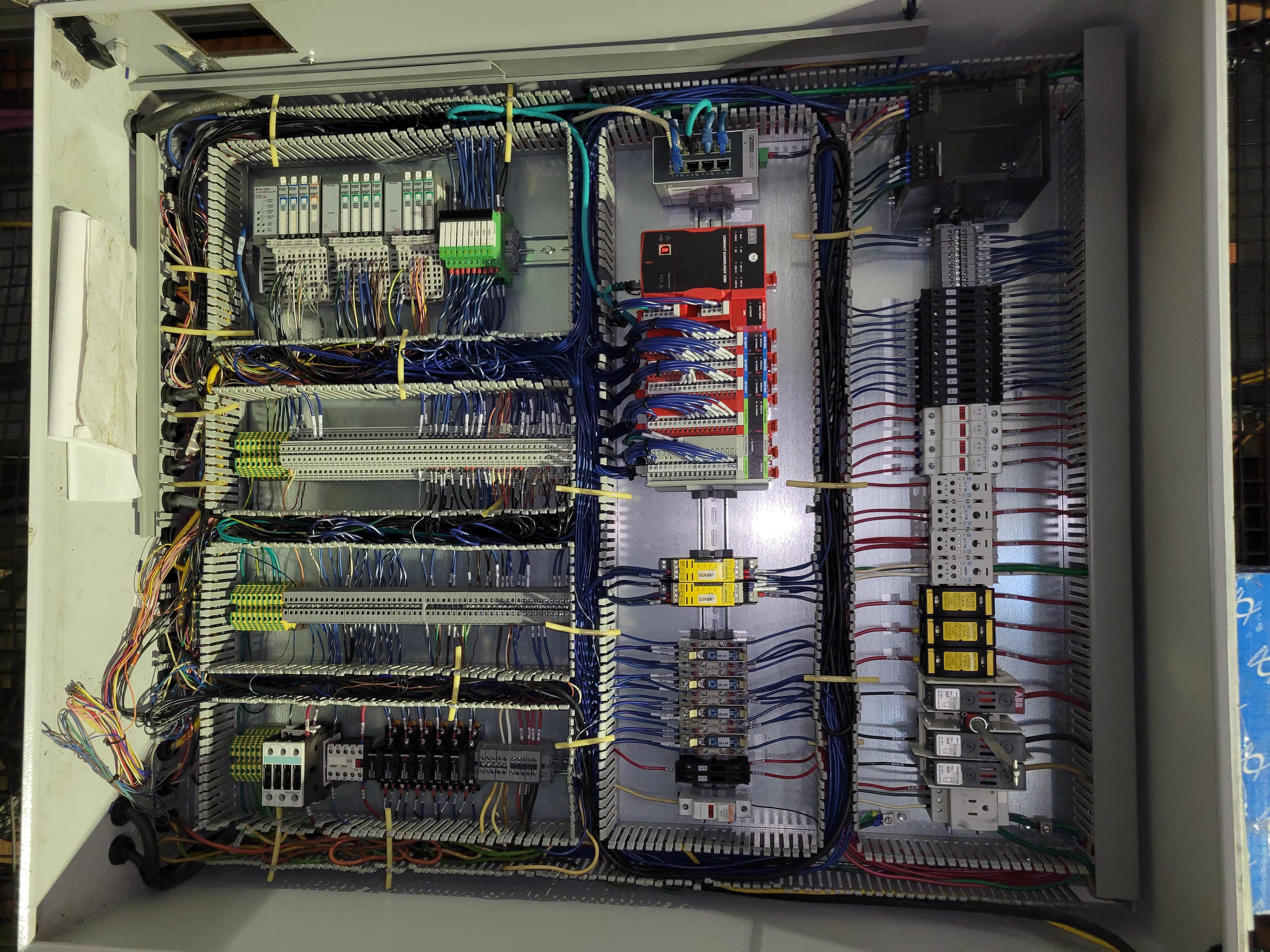Completed control panel rewire with new PLC and safety relays installed