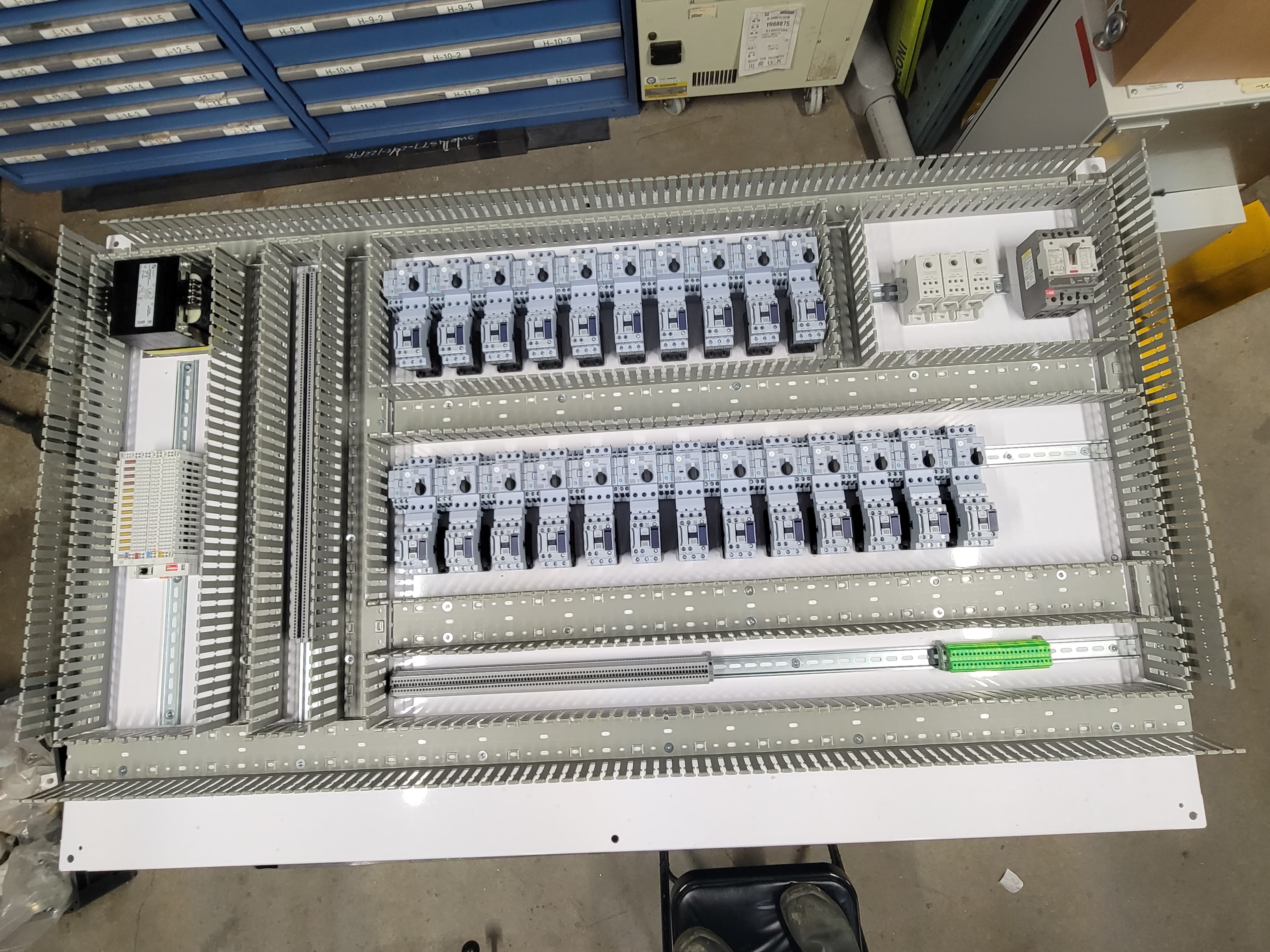 Control panel backplate layout with DIN rail and mounting hardware